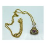 An 8ct gold chain & pendant set with diamonds & ru