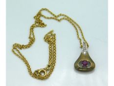 An 8ct gold chain & pendant set with diamonds & ru