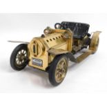 A limited edition brass Mamod roadster sports car,