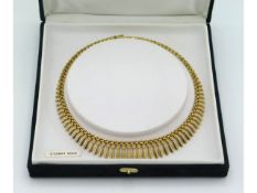 A 9ct gold necklace, 16in long, 19.3g