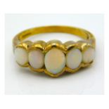 A 9ct gold ring set with five opals, size M/N, 3.2