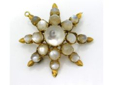 An antique yellow metal mounted pendant & brooch s