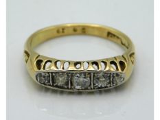 An antique 18ct gold five stone ring set with 0.3c
