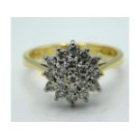 An 18ct gold diamond cluster ring of approx. 0.57c
