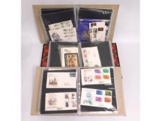 A quantity of three albums of first day covers, some from the 1960's, presentation packs & two coin