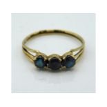 A 9ct gold antique ring set with three alexandrite