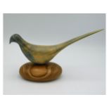 A Peter Vernon carved pheasant bird figure, 11in long