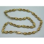 A 9ct gold necklace of decorative form, 16.5in lon