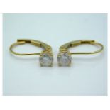 A pair of 14ct gold earrings set with diamonds, approx. 0.6ct total, 1g