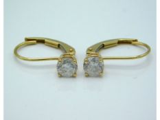 A pair of 14ct gold earrings set with diamonds, approx. 0.6ct total, 1g
