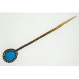 A 19thC. yellow metal tie pin set with turquoise & rose cut diamonds with original box, tests electr