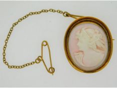 A yellow metal mounted cameo brooch, tests electronically as 12ct gold, 28mm x 21mm, 6.2g