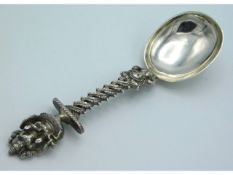 A well worked Indian white metal spoon with Indian