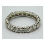A white metal eternity ring set with approx. 2ct d