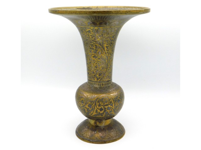 A 19thC. Persian style brass vase with silver inla