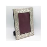 A 1997 London silver photo frame by Paul Vernon Fitchie of organic design, 10.75in high x 8in wide,