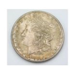 An 1882 silver US one dollar coin, 26.8g