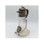 A 19thC. etched glass claret jug with sliver plate