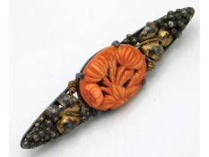 An antique bar brooch with carved coral, 60mm wide
