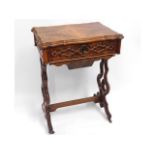 A 19thC. walnut work table with carved decor, 21.5