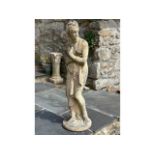 A reconstituted stone garden figure of neo-classical influence, 46in tall