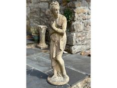 A reconstituted stone garden figure of neo-classical influence, 46in tall