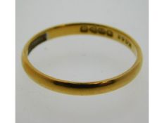 A 22ct gold band, size P/Q, 2.1g