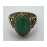 An antique 9ct gold jade ring, some discolouration