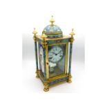 A French brass cloisonne clock with domed top & en