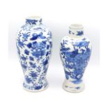 A pair of antique Chinese porcelain vases, the lar