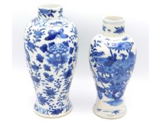 A pair of antique Chinese porcelain vases, the lar