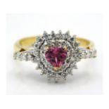 An 18ct gold ring set with heart shaped pink topaz