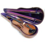 An antique violin with two piece back, sold with its crocodile style skin case & two bows. One bow w