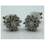 A pair of yellow metal diamond cluster earrings, a
