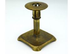 An arts & crafts Geschutzt bronze candle holder, 4