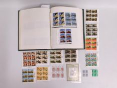 An album of British mint stamps including definitives, in excess of £280 face value of mint stamps