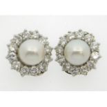 A pair of 18ct white gold pearl & diamond clip on diamond earrings, 14.5mm diameter, approx. 1.68ct