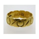 A decorative 18ct gold band, internally inscribed