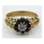 A 9ct gold ring set with diamond & sapphire, size