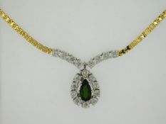 A 14ct gold necklace set with green tourmaline & 0.18ct of illusion set diamonds, 19in long, 10.9g,