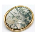 An antique yellow metal mounted moss agate brooch,