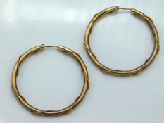 A pair of hoop earrings with rope twist decor, 2.8