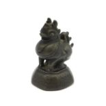 A 19thC. Chinese bronze opium weight, 2.6in tall