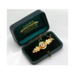 A 15ct gold brooch set with sapphire & diamond, 42