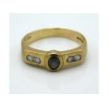 A 9ct gold ring set with white stones & alexandrit