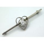An antique white metal bar brooch set with approx.