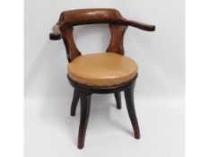 A 19thC. captains swivel chair, small loss to rear trim, 31.5in high to back
