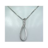 An 18ct white gold necklace with pendant set with