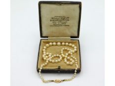 An antique cultured pearl necklace with 14ct gold