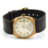A yellow metal cased shock proof wrist watch lacking one hand, tests electronically as 9ct gold, cas